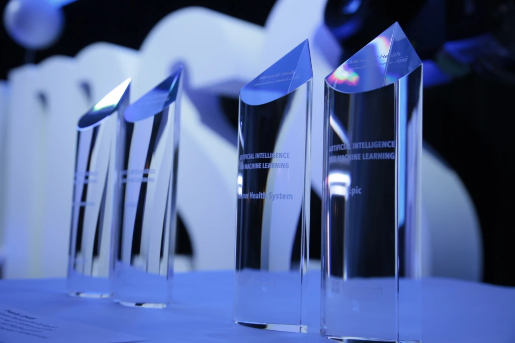 Four MHIA awards displayed on a table