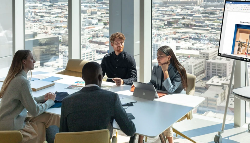 Business professionals sitting around a conference table