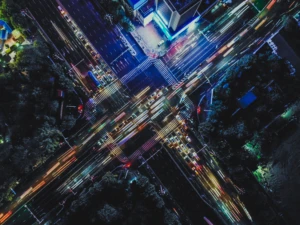 Drone Point View of City Street Crossing at Rush Hour, Long Exposure