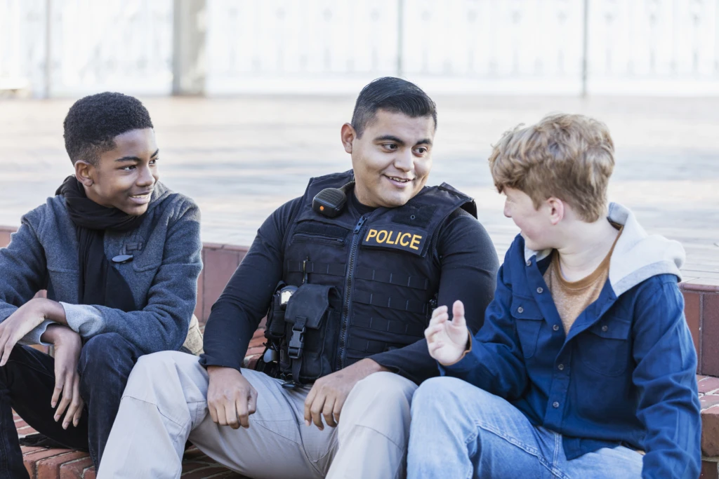 a group of people sitting on a bench