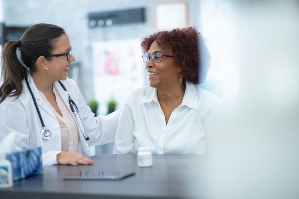 A doctor talking with their patient