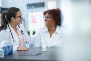 A doctor talking with their patient