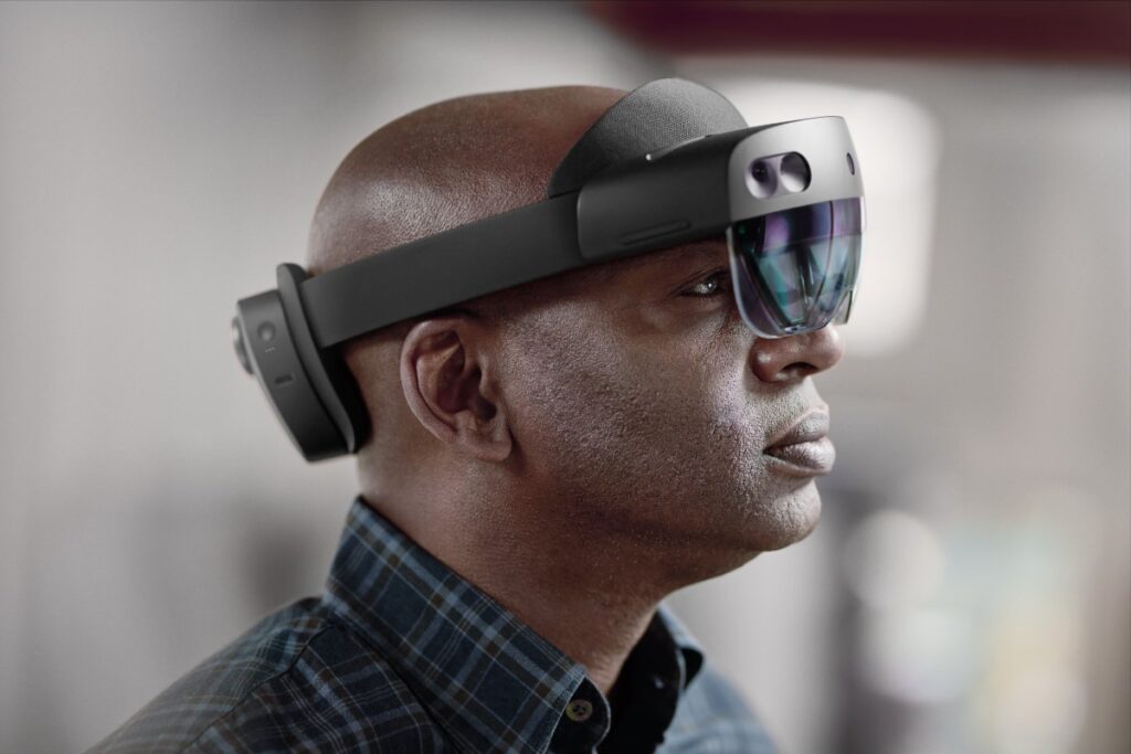 Man using Microsoft HoloLens 2.