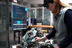 Woman using Dynamics 365 Guides to assemble an engine.
