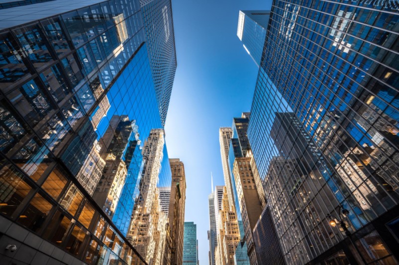 Looking up at tall buildings in a financial district