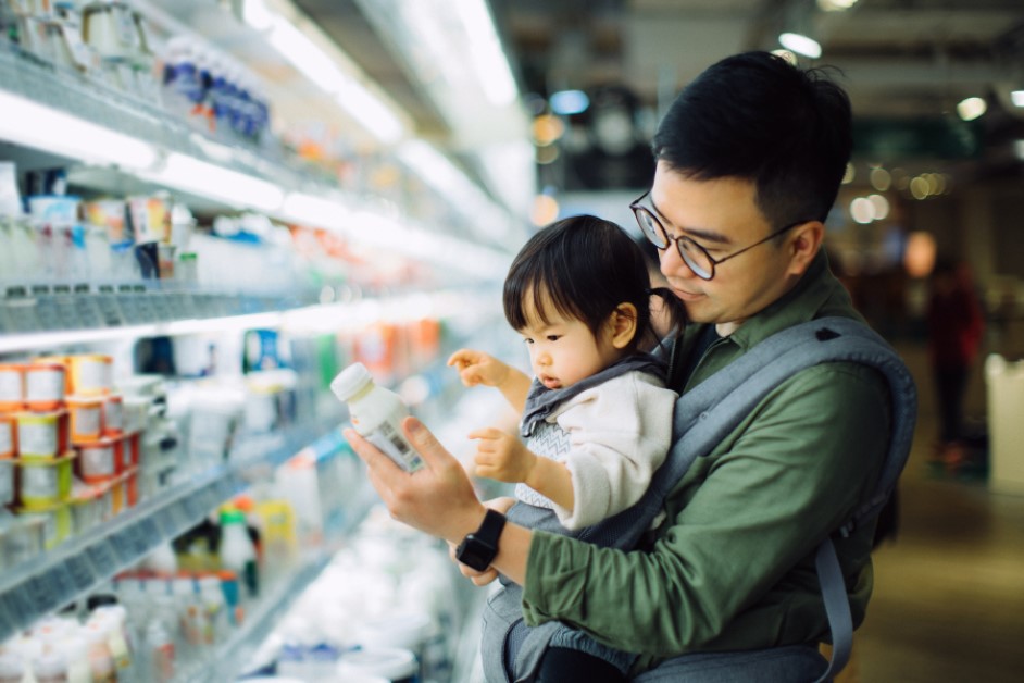 A father and child shopping in a grocery store