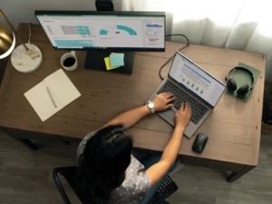 A woman working at her desk from home showing resilience in action