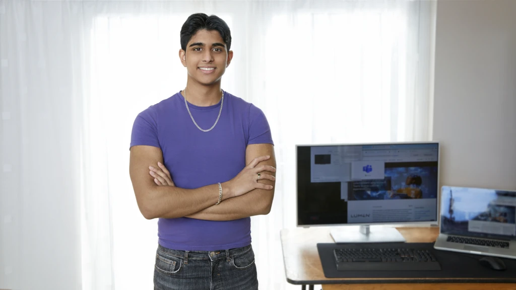 a person standing in front of a computer