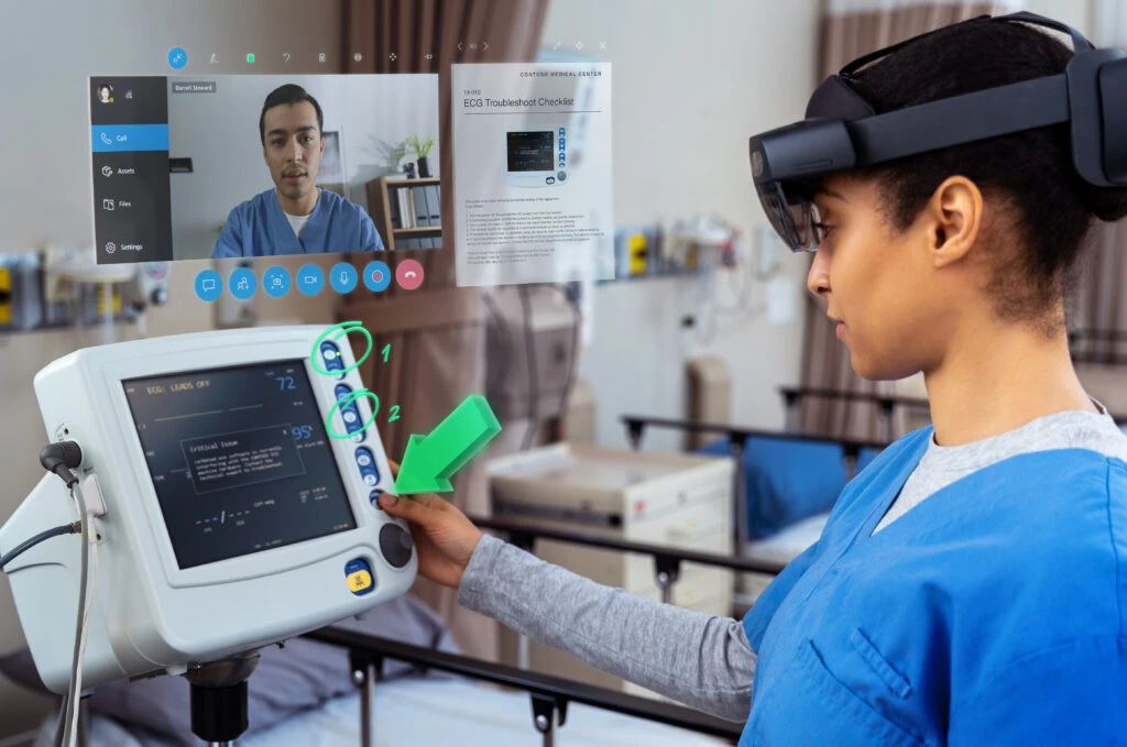A nurse using Dynamics 365 Remote Assist on HoloLens 2 to collaborate with a remote expert in real-time.