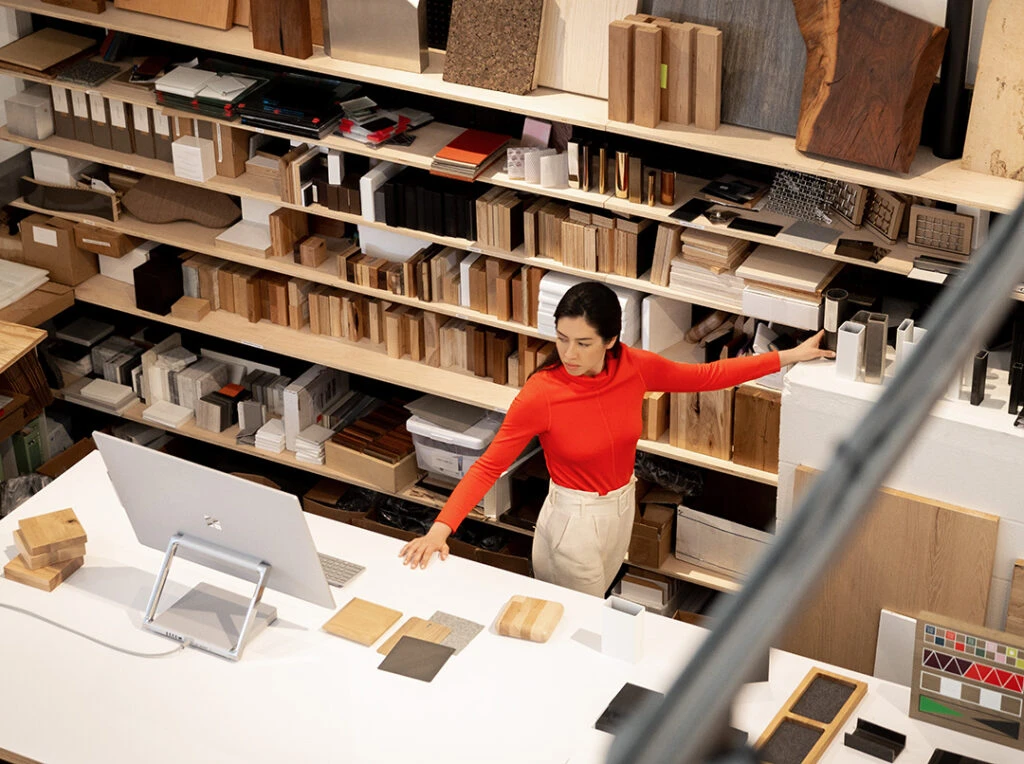 Woman working on Surface Studio2 inside a store