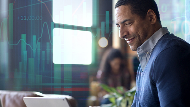 man looking at his monitor