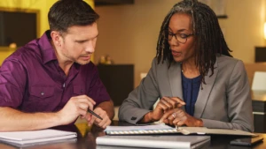 a man and a woman working in an office together