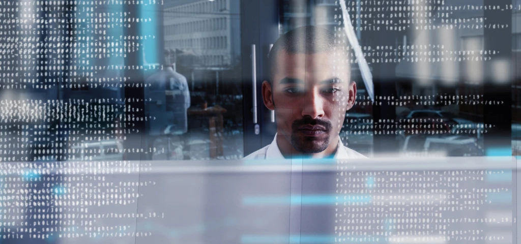 Cropped shot of a young computer programmer looking through data