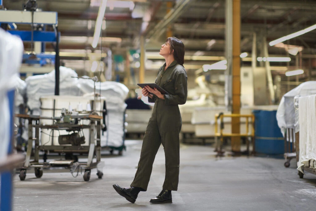 CEO of a textile manufacturing plant managing inventory on the warehouse floor