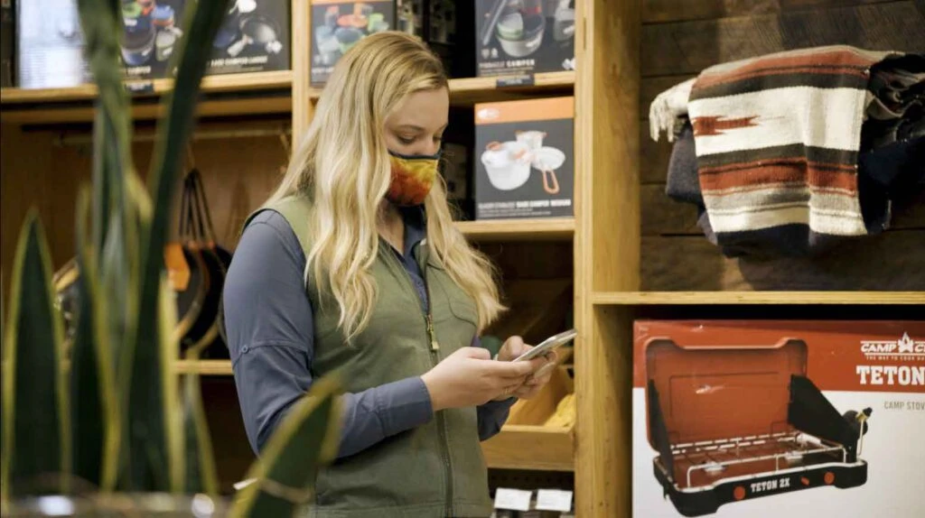 An REI sales employee uses Microsoft Teams to have a virtual outfitting appointment with a customer.