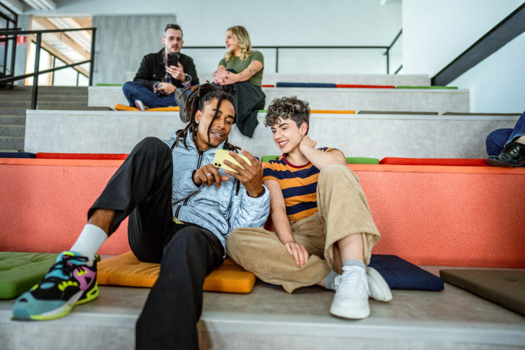 A group of people sitting on the stairs