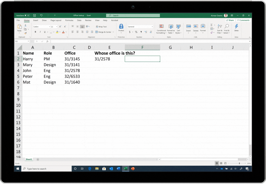 An animated image of Excel's XLOOKUP function being used on a tablet. The user is looking up offices, names, and roles.