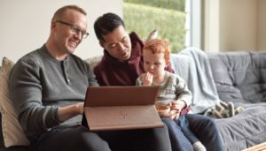 Family with fathers and son using HP Spectre X360 15.