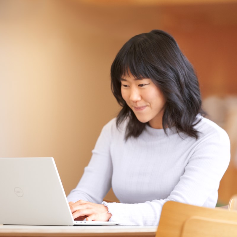 Hybrid employee using laptop.