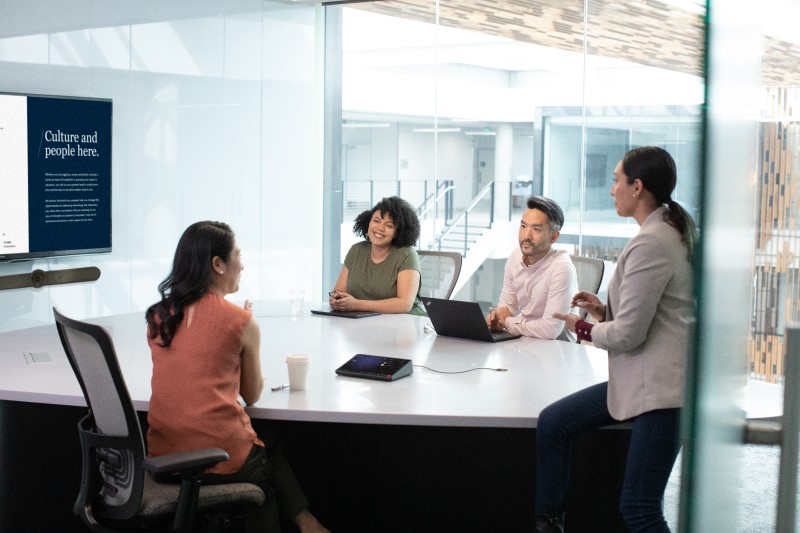 In-person meeting in a medium sized conference room with a companion device.