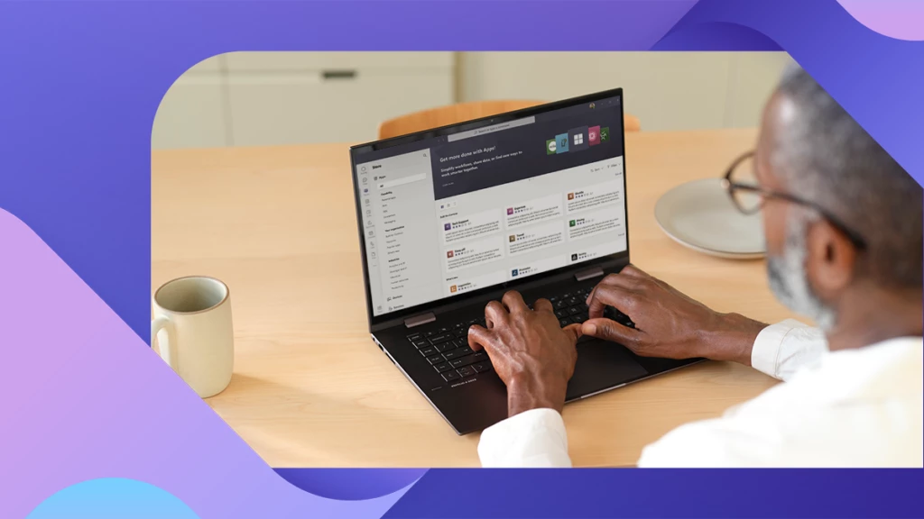 A person working on a laptop showing the app store in Microsoft Teams.