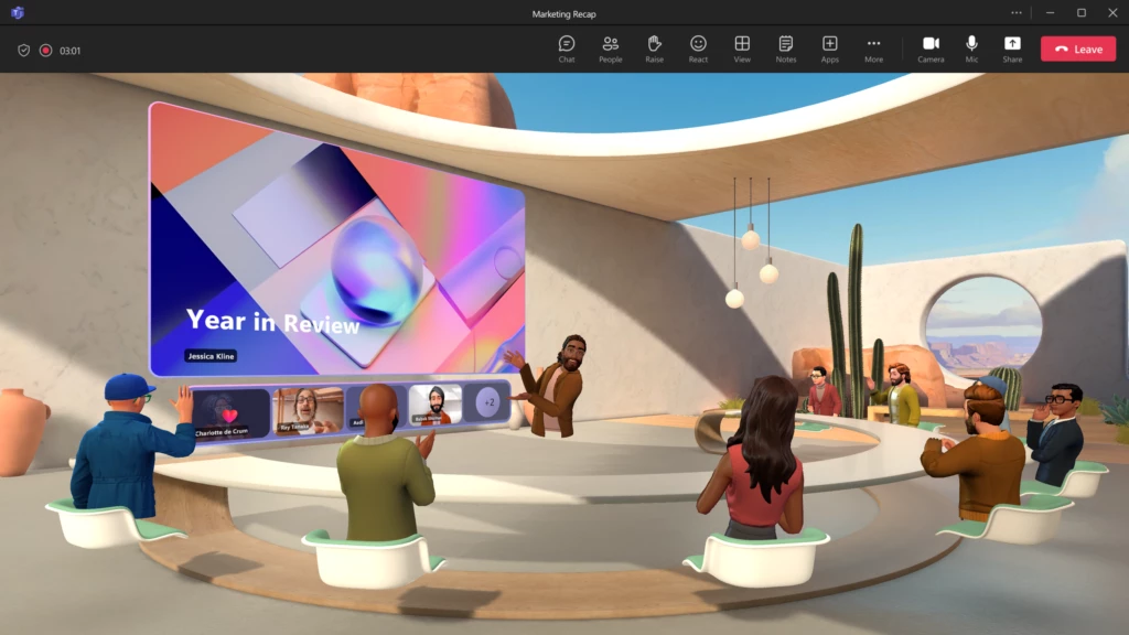 Avatar in brown cardigan standing in the center of the room. Seven avatars seated around a table facing the avatar in the center, who is gesturing towards a "Year in Review" presentation projected on the wall.