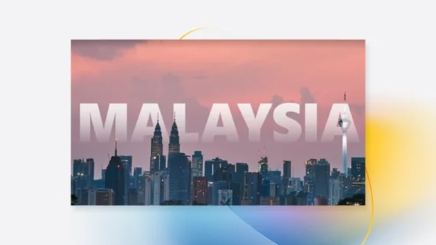 A decorative graphic that has a picture of a Malaysian cityscape and the word "Malaysia" overlayed