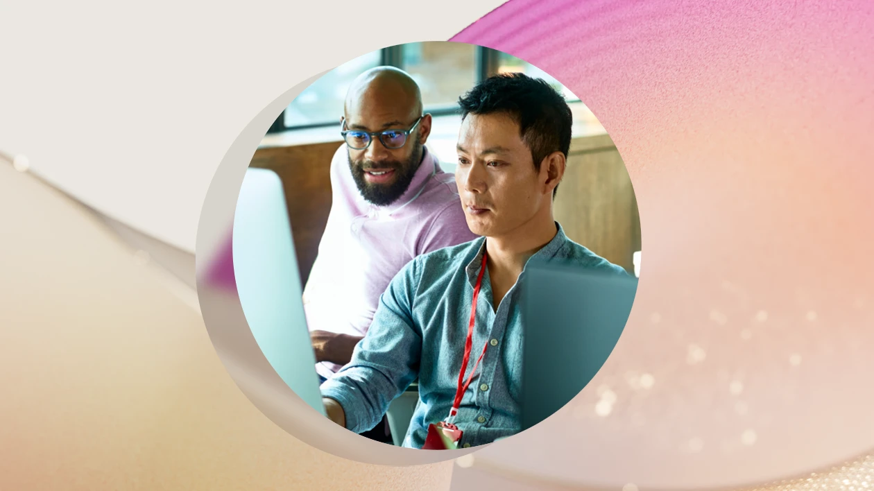 A group of men looking at a computer screen