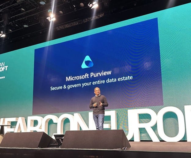 Rudra Mitra on stage at FabCon 2024 event discussing Microsoft Purview.