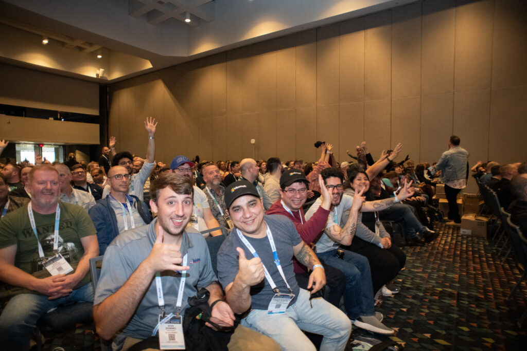 Excited attendees in their seats.