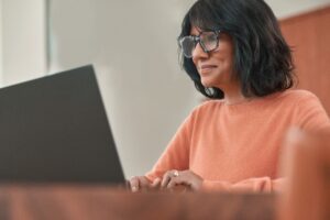 Woman working from home at her laptop.