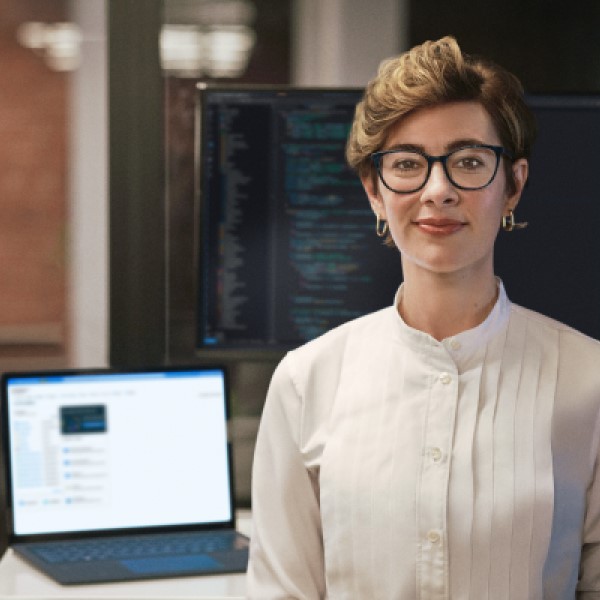 a person standing in front of a computer