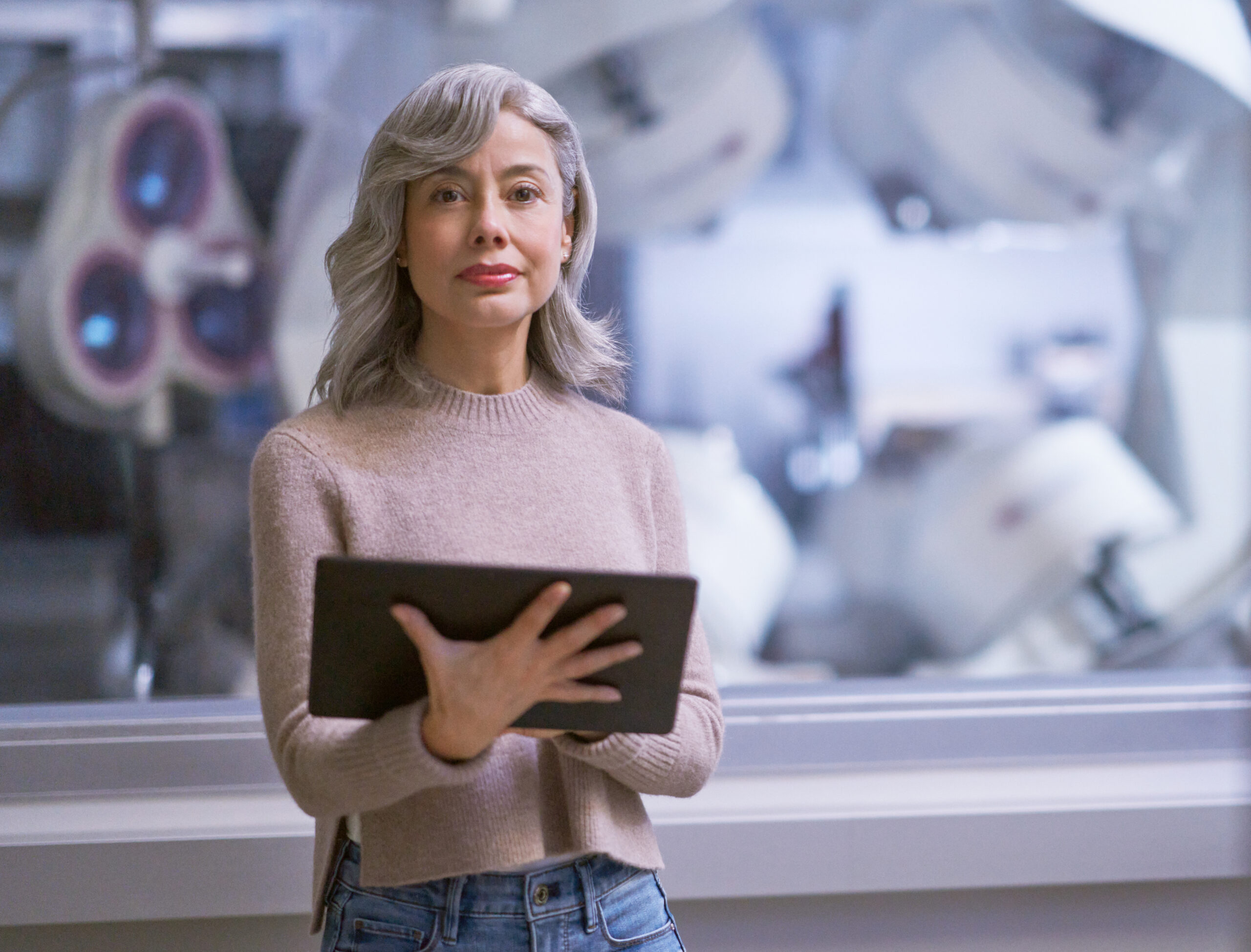 A woman holding a tablet