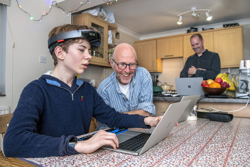 Theo, left, a 12-year-old boy who is blind, interacts with Microsoft senior research software development engineers Tim Regan, middle, and Martin Grayson, right, during user testing of the Project Tokyo system. Photo by Jonathan Banks.