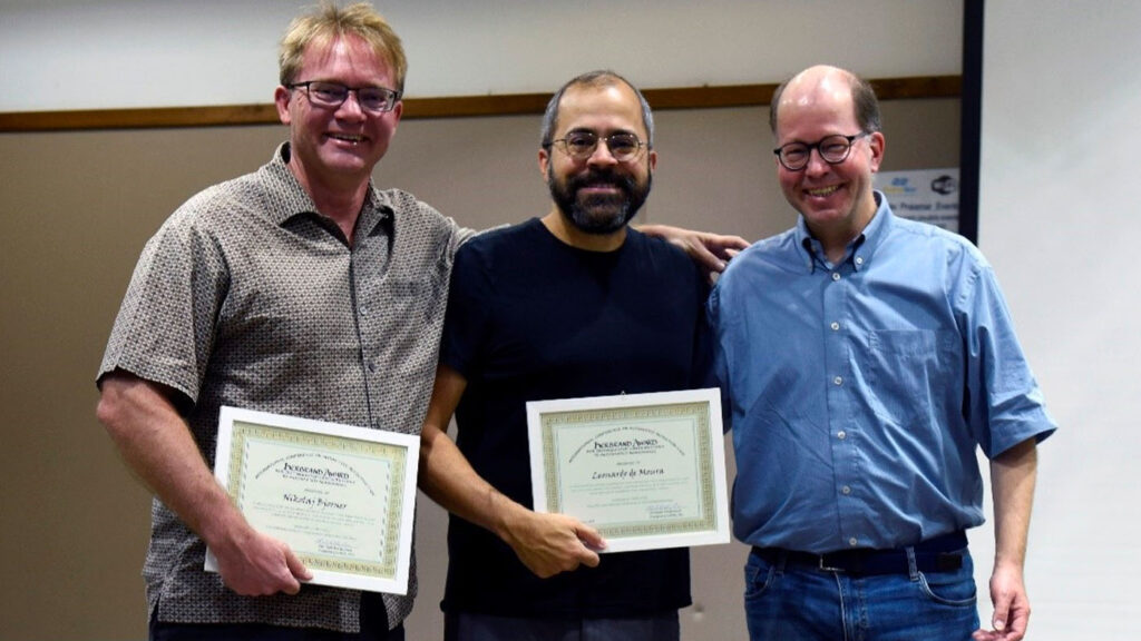 Microsoft researchers Nikolaj Bjørner (left) and Leonardo de Moura (center) received the 2019 Herbrand Award for Distinguished Contributions to Automated Reasoning in recognition of their work in advancing theorem proving. They’re pictured with Jürgen Giesl (right) of the award committee.