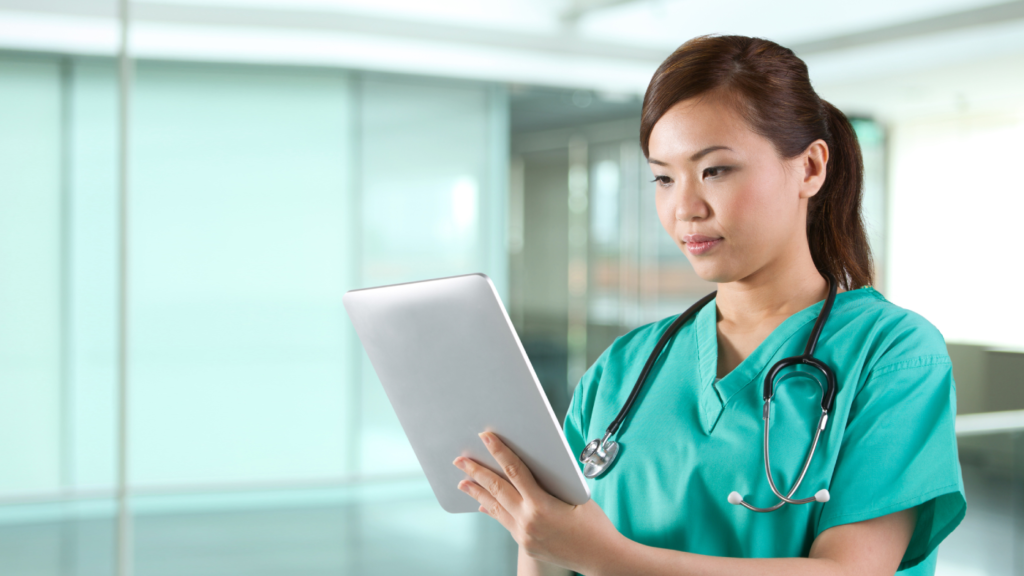 photo of nurse reviewing a tablet