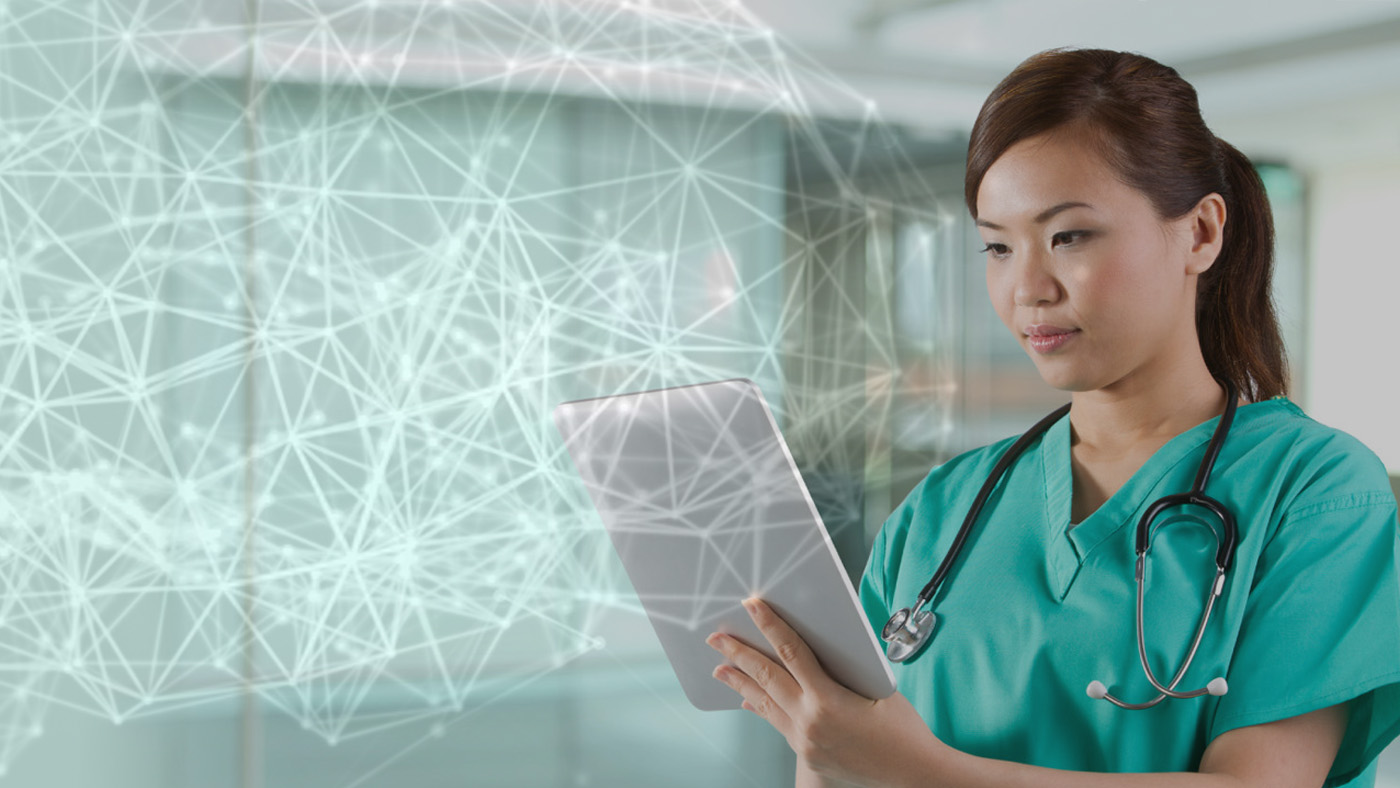 AI and the future of health - female doctor reviewing tablet