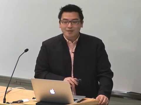 a person sitting in front of a laptop computer