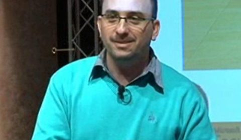 a man in a blue shirt