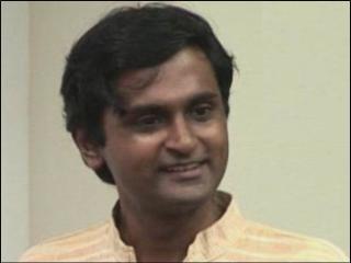 a man smiling for the camera