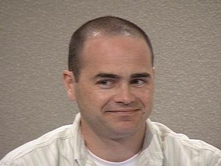 a man smiling for the camera