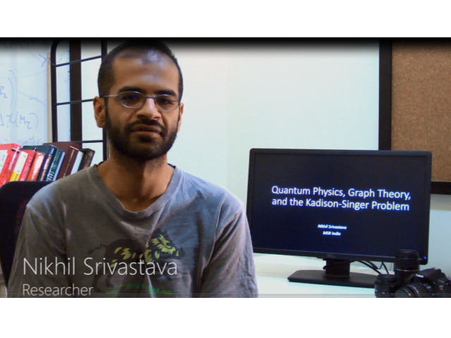 Nikhil Srivastava sitting in front of a computer screen