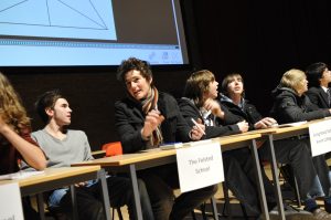 a group of people sitting at a desk