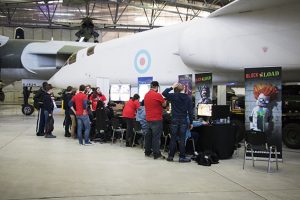 a group of people standing around a plane