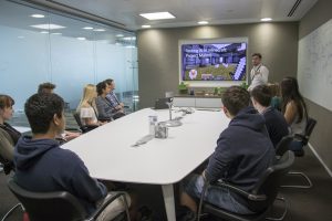 a group of people sitting at a table in a room