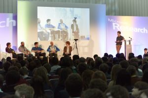 a group of people standing in front of a crowd