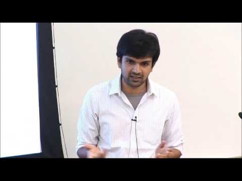 a man standing in front of a computer screen