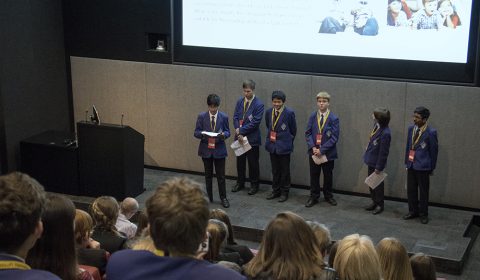 a group of people standing in front of a crowd