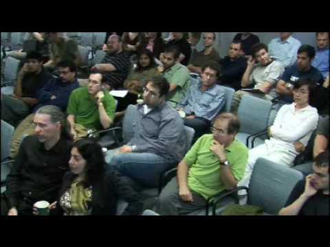 a group of people sitting in front of a crowd