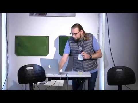 a man standing in front of a computer